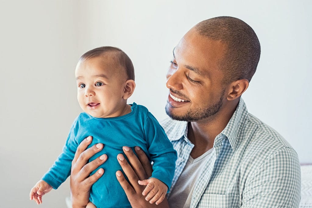 Man holding a baby