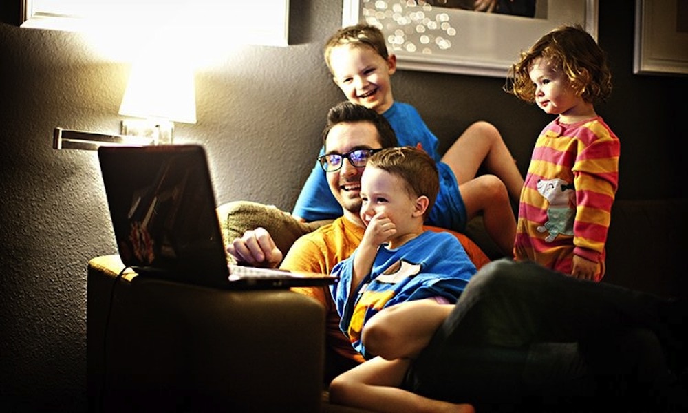 Young dad with 3 kids having fun