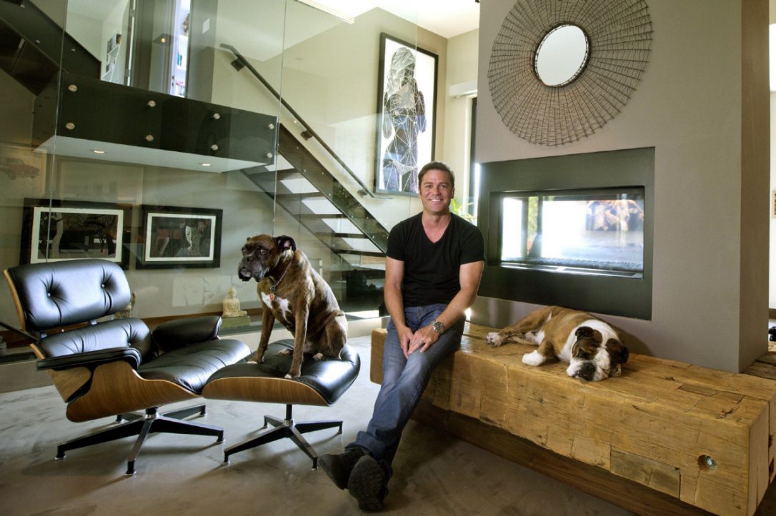 Actor Yannick Bisson pictured in his home with his dog next to him