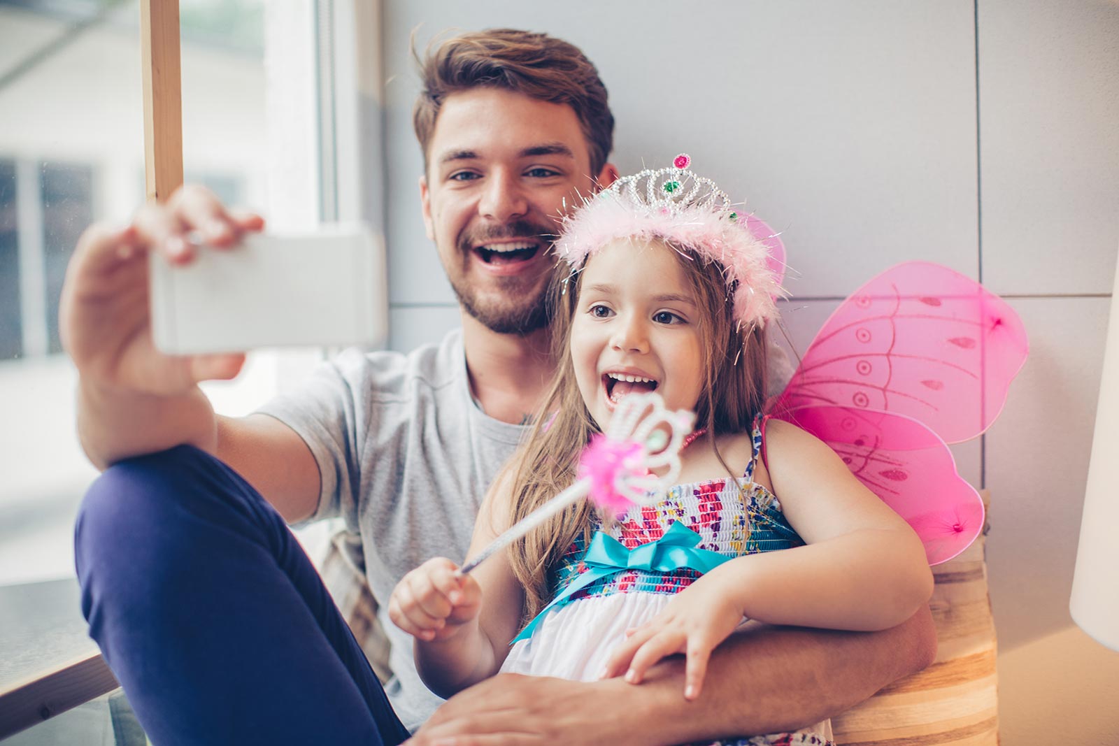 Dad and daughter taking a selfie