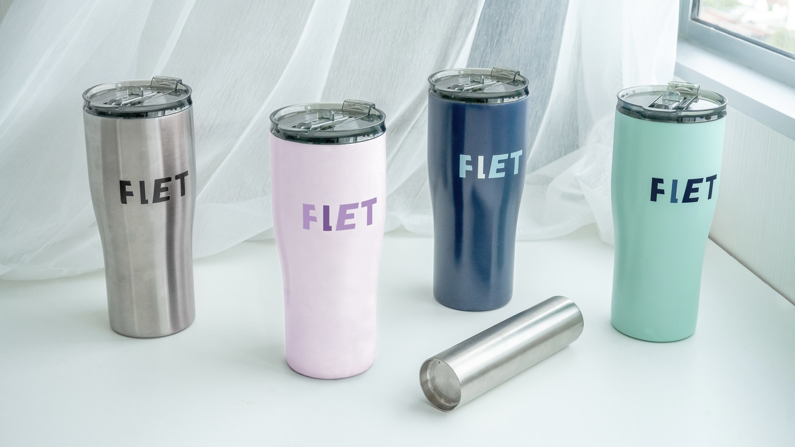 A picture of 4 tumblers with different colors