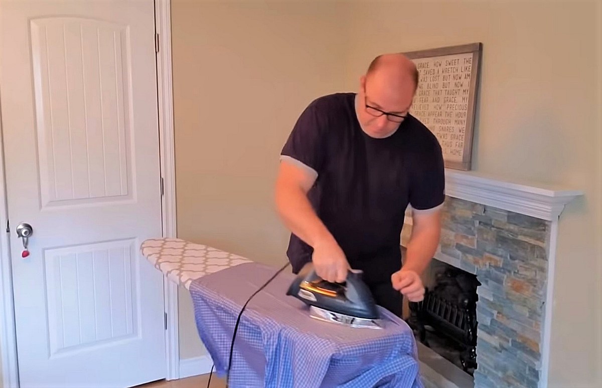 The host of Dad, How Do I? showing how to iron shirts