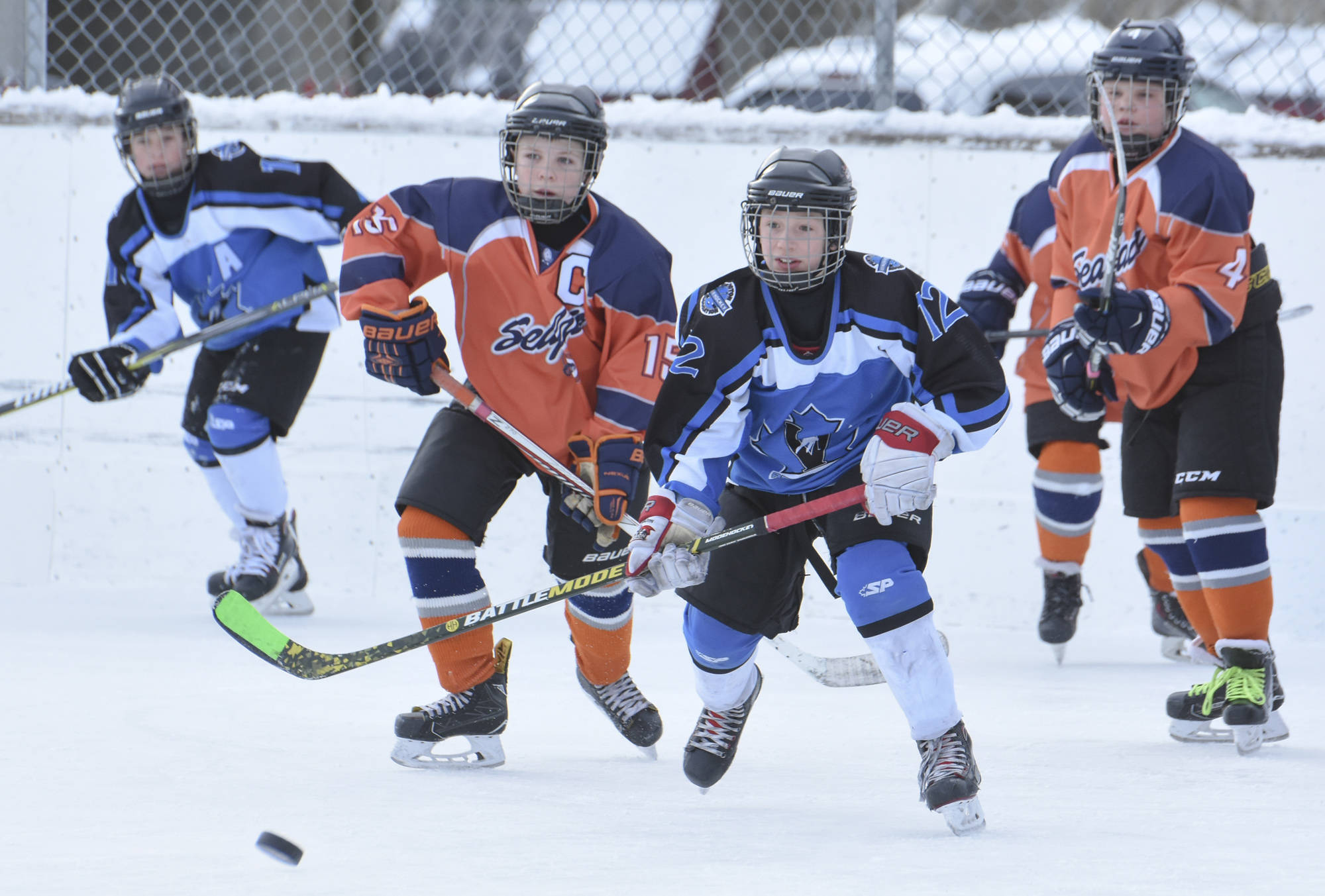 young boys playing hockey