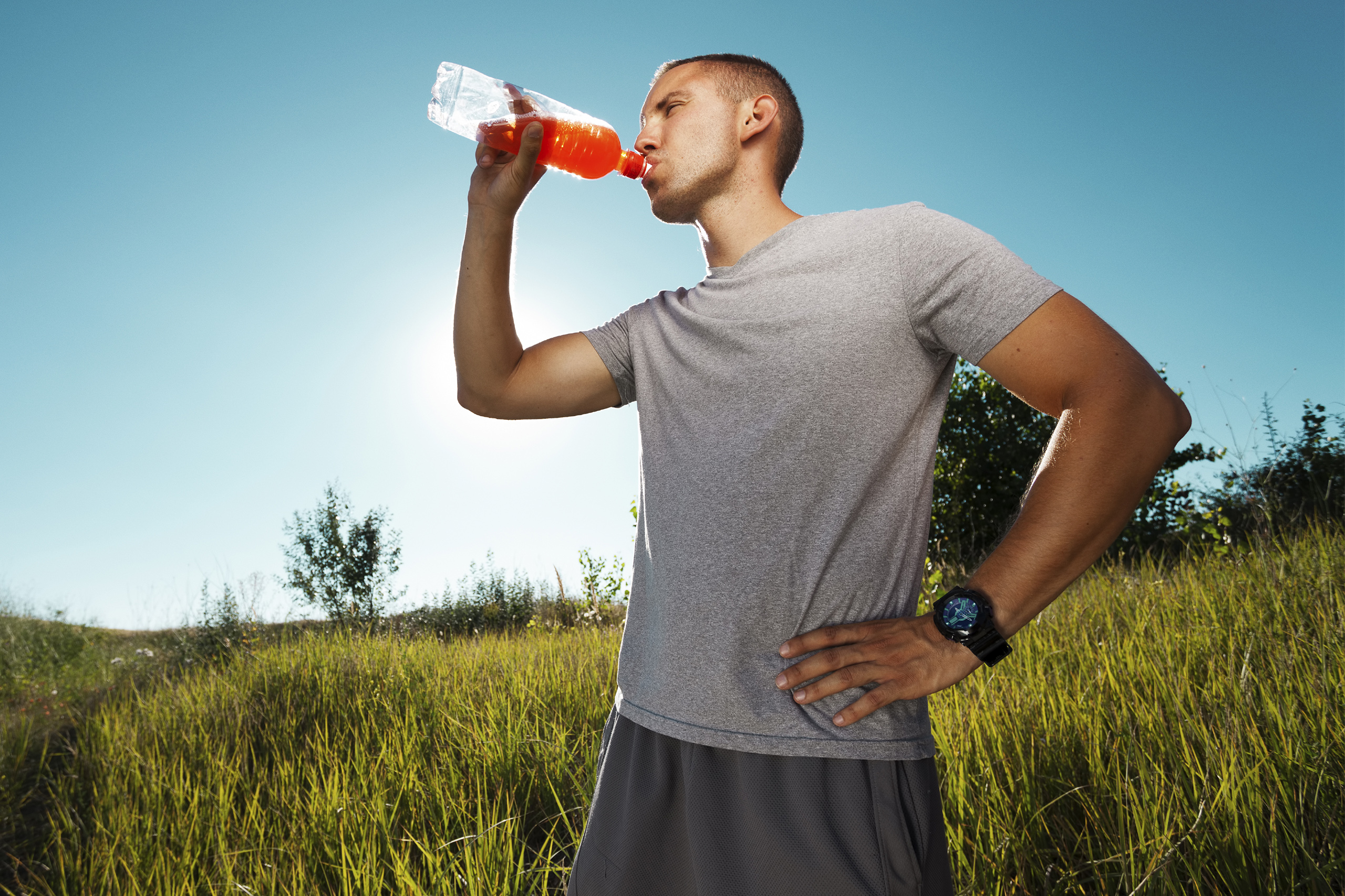 Young man drinking a sports drink