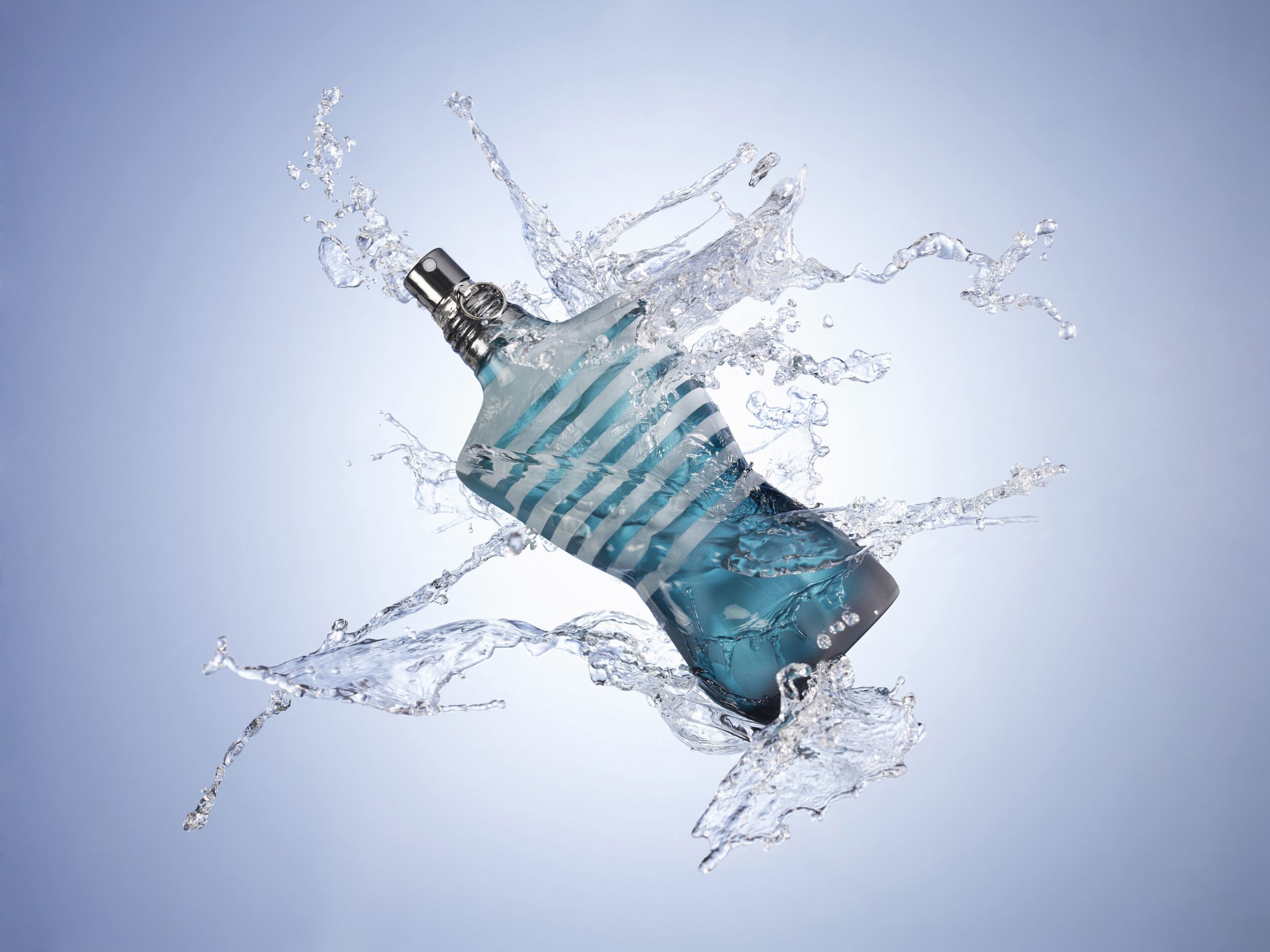 An aquatic cologne splashed with water
