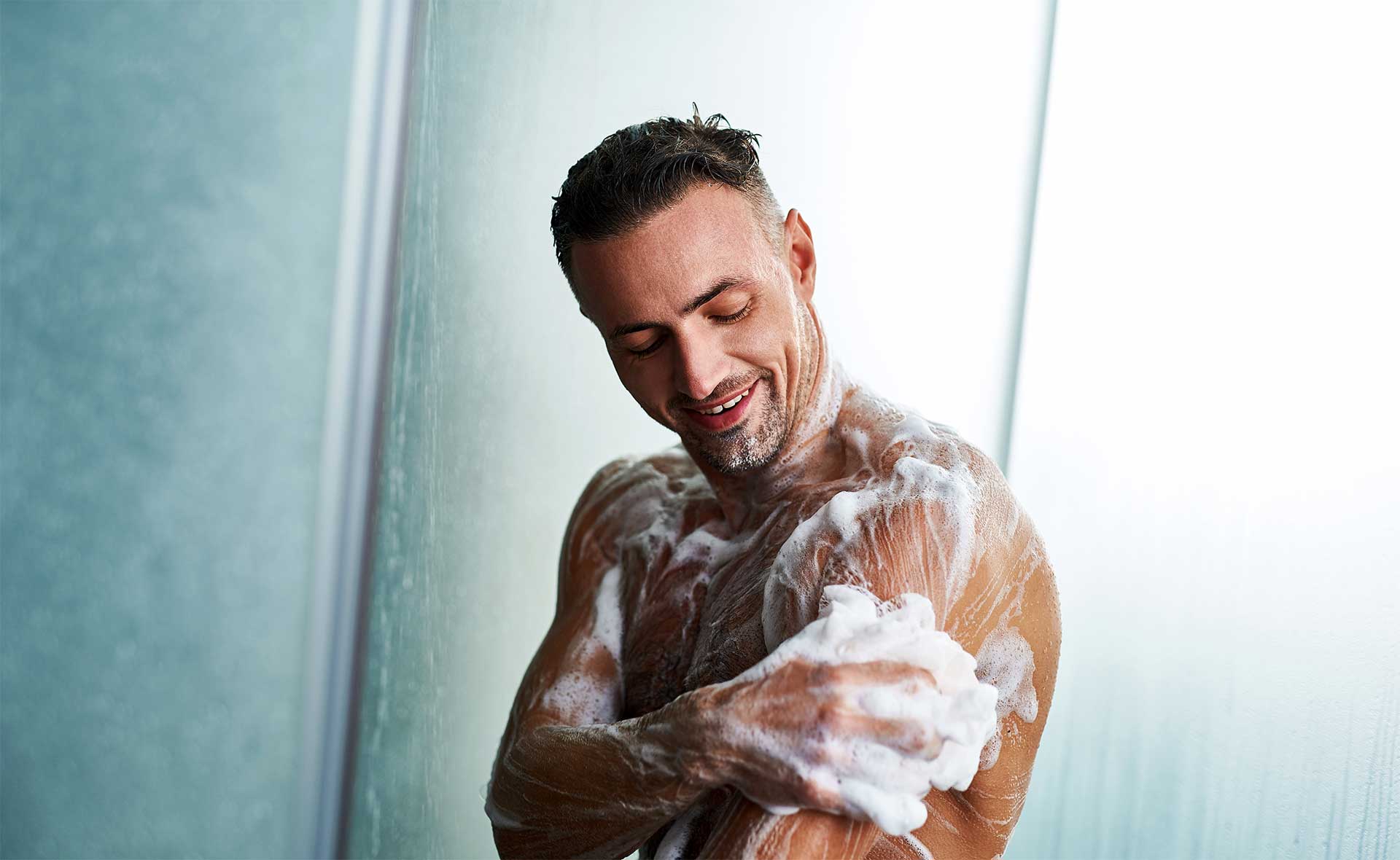 guy using a body wash